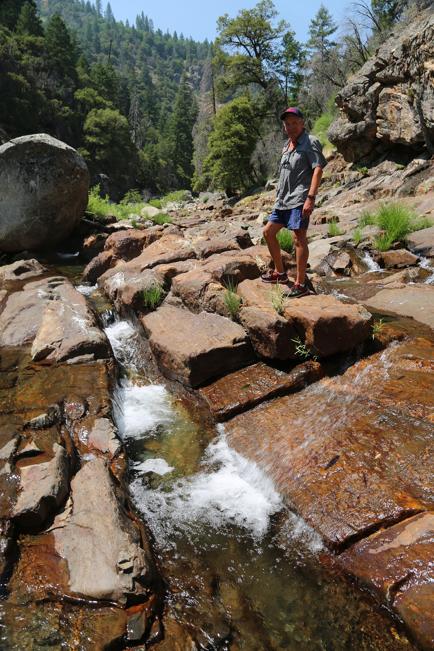 cameron mitchell photo of man standing on river