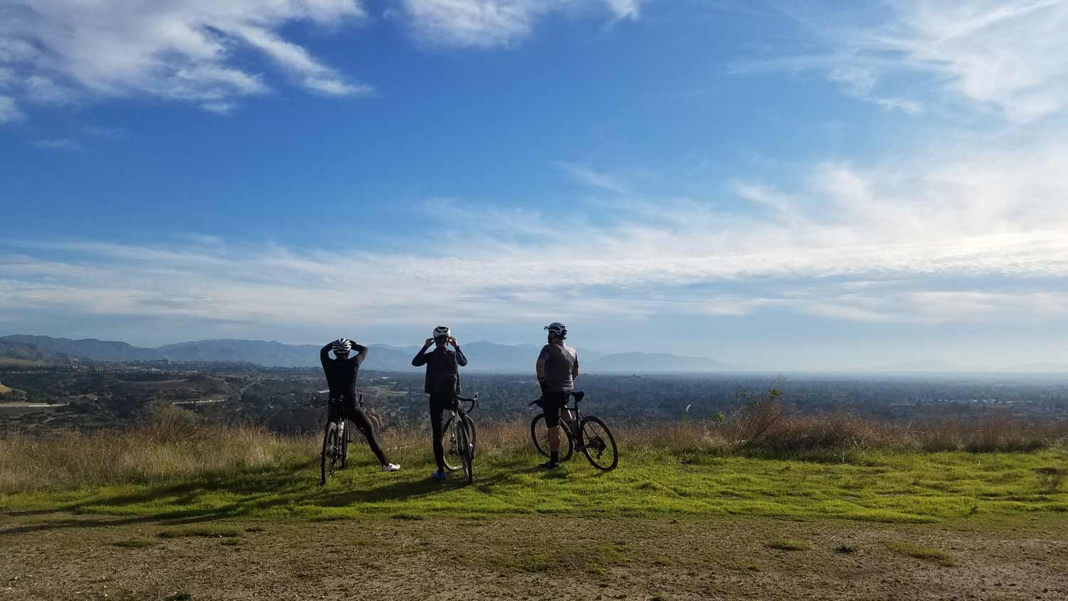 three bikers in a distance
